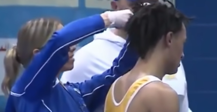 A high school wrestler gets an infamous pre-match haircut at Buena.