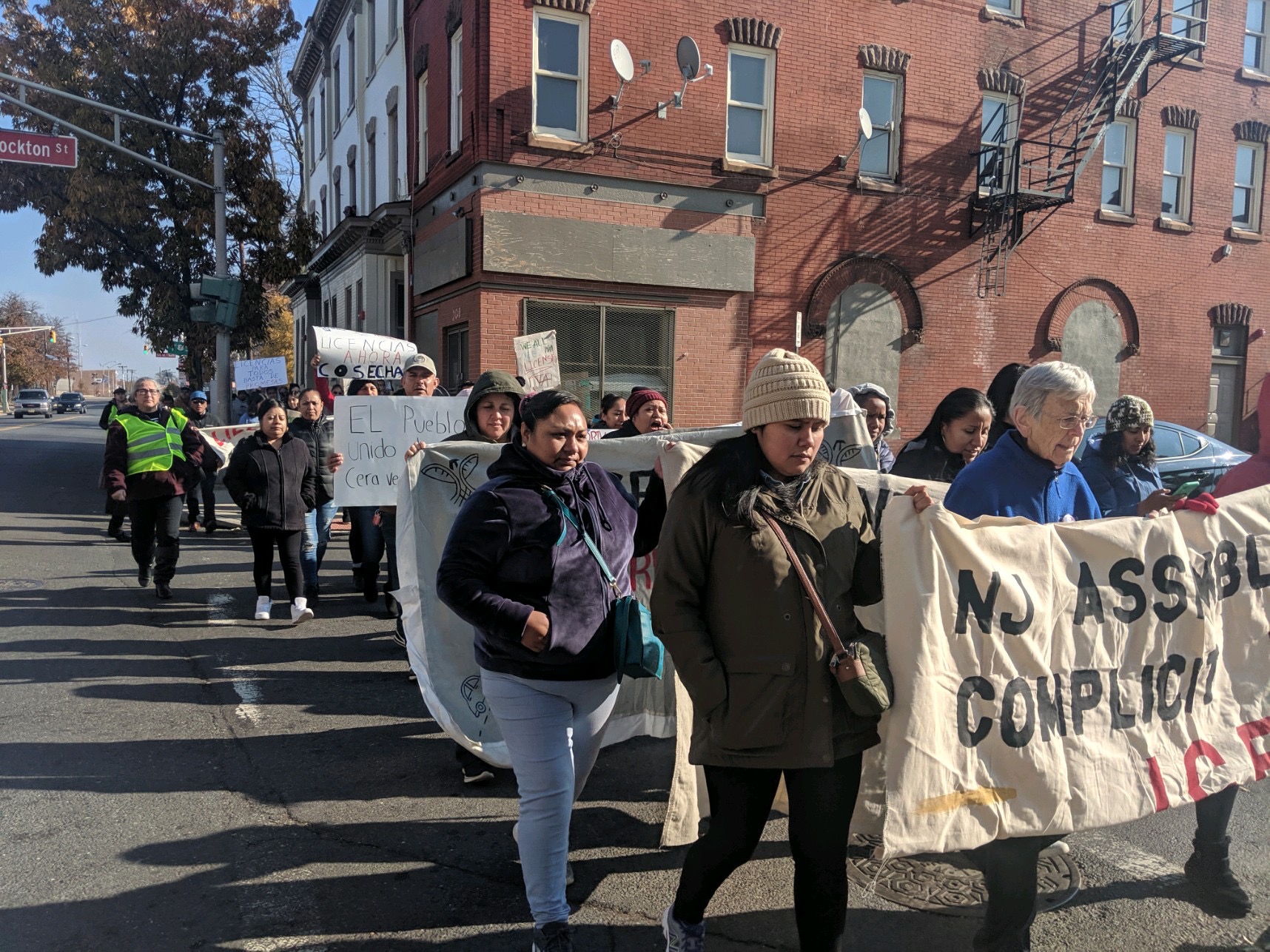 Activists march in Trenton for driver's licenses for undocumented workers.