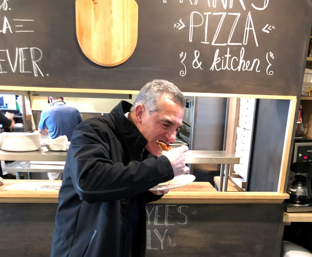 Ciattarelli devours pizza.