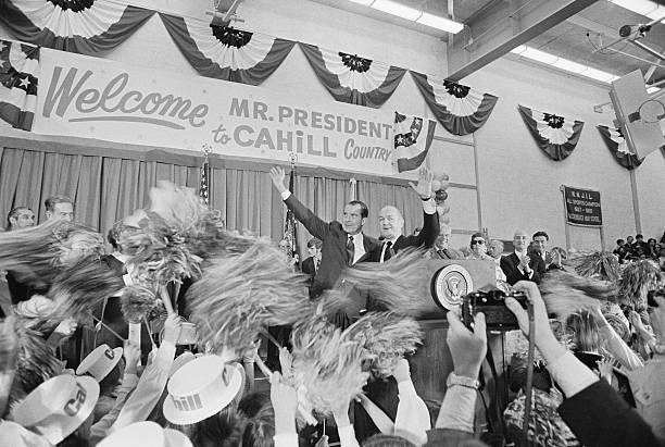 President Nixon and Bill Cahill Waving from Podium (Photo by © Wally McNamee/CORBIS/Corbis via Getty Images)