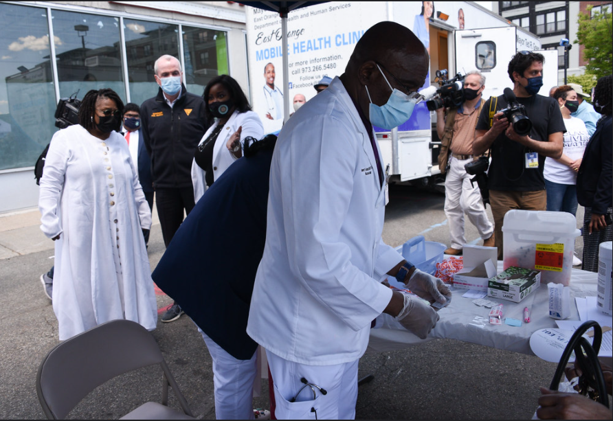 Governor Murphy, First Lady Tammy Murphy, Lieutenant Governor Sheila Oliver, Whoopi Goldberg, Essex County Executive Joe DiVincenzo, Reverend Melvin Wilson, and the Office of East Orange Mayor Ted Green participate in a “Grateful for the Shot” Vaccination Event in East Orange on Friday, May 14th,