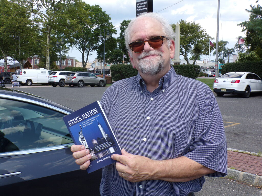 Bob Hennelly with a copy of Stuck Nation.