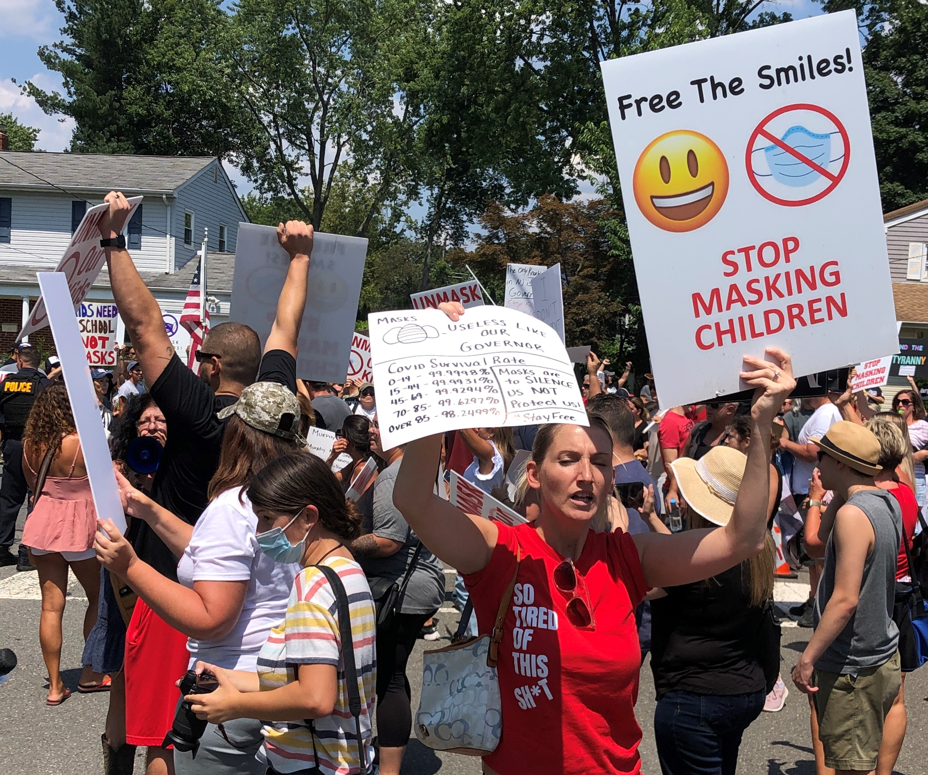 Anti-mask protesters greet Murphy.